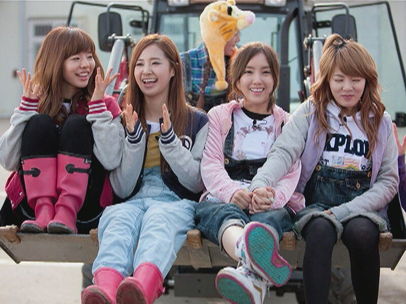 Girls sitting on a truck bed