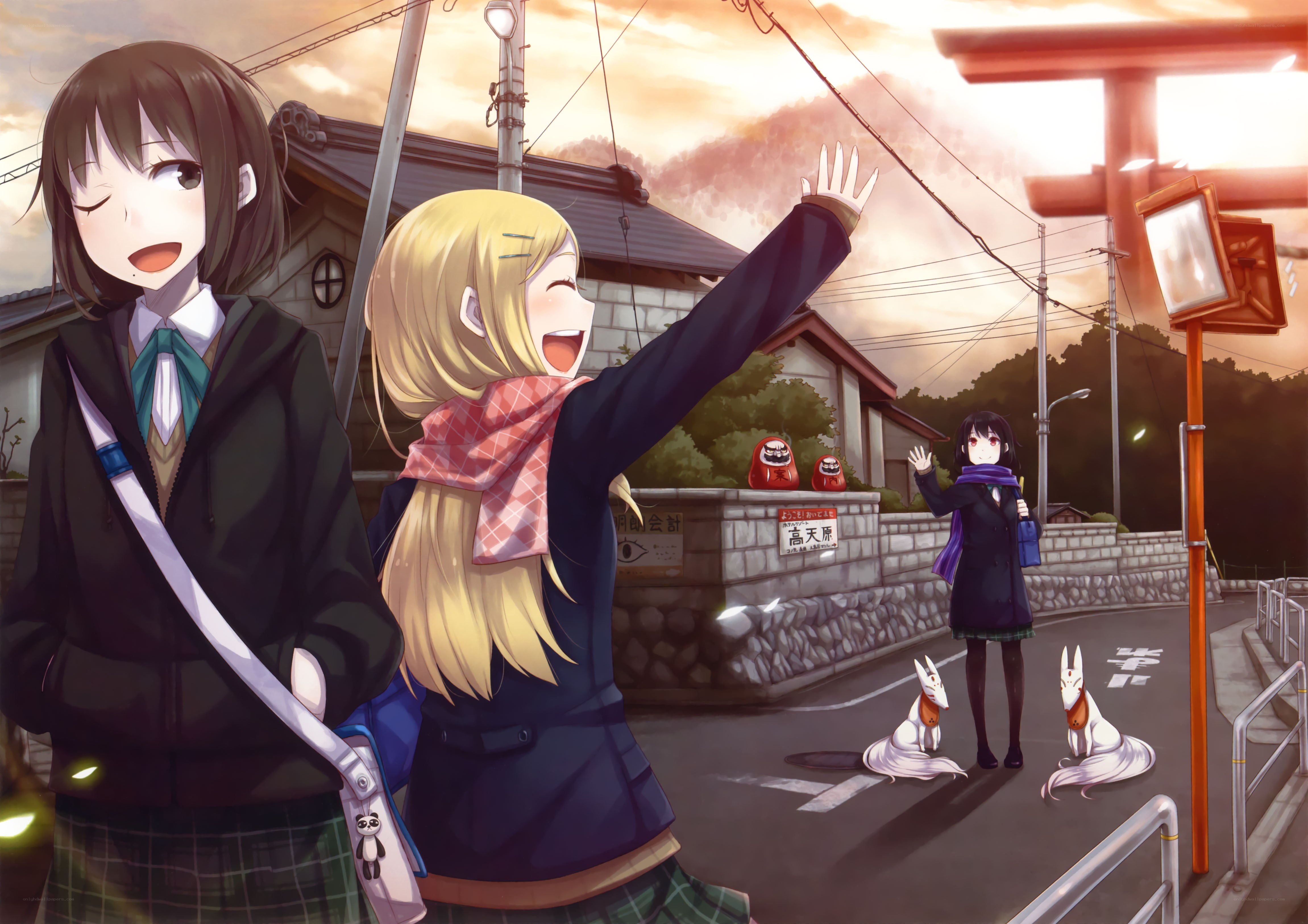 Girls waving at a shrine