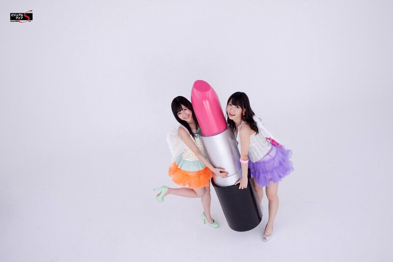 Girls with giant lipstick prop