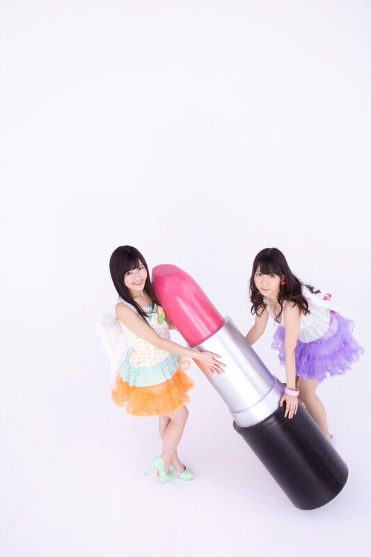 Girls with giant lipstick prop