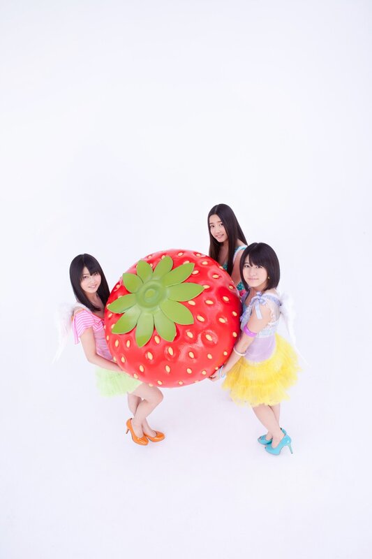 Girls with giant strawberry prop