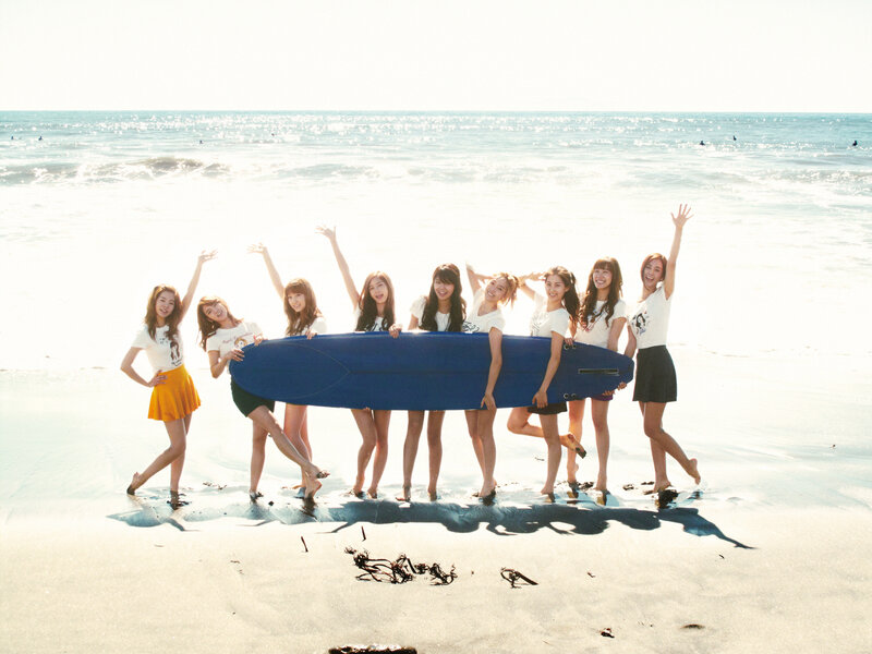 Girls with surfboard on beach