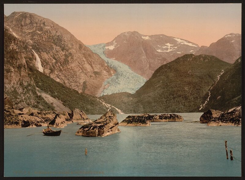 Glacier and boat in fjord