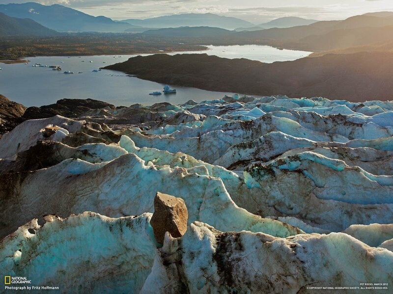 Glacier and icebergs in a fjord
