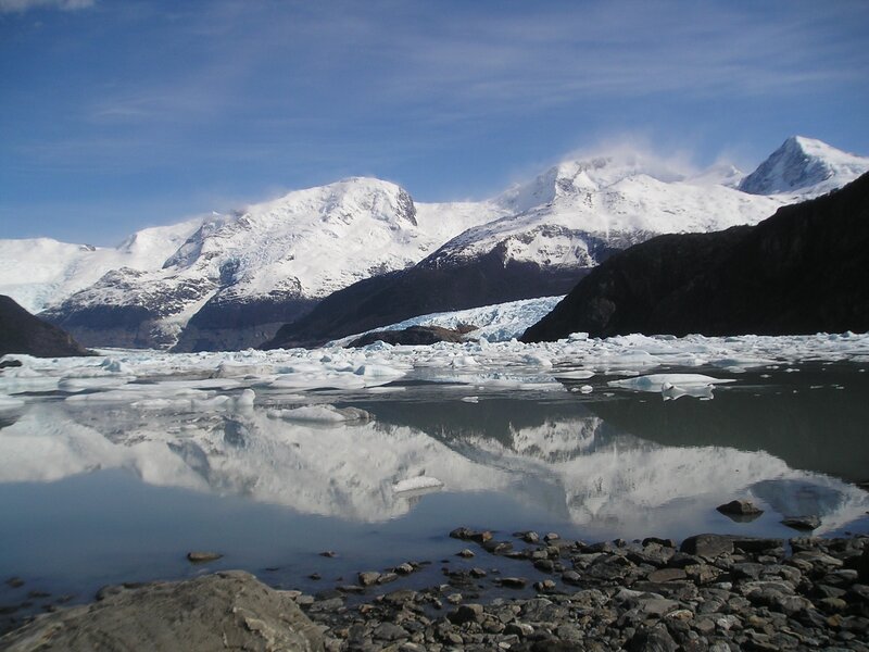 Glacier and icebergs in a mountain lake
