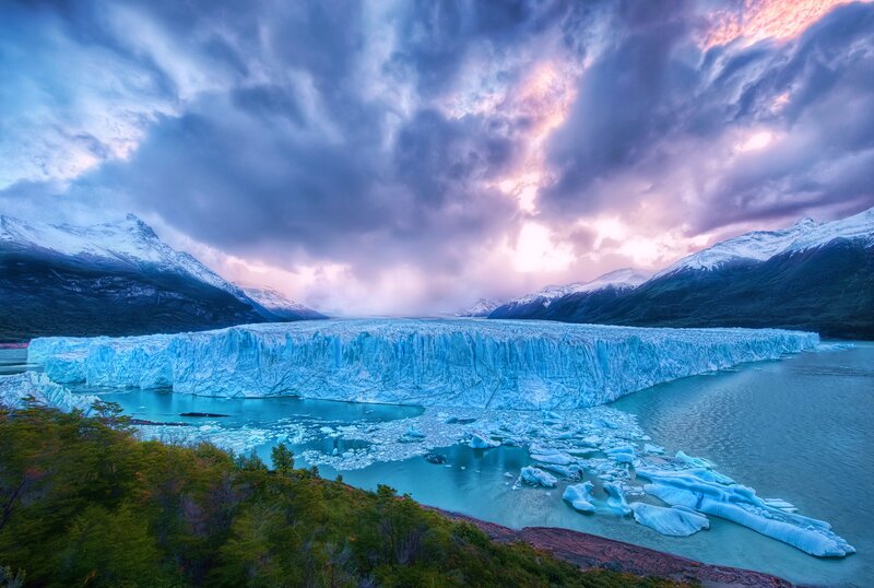 Glacier at sunset with icebergs
