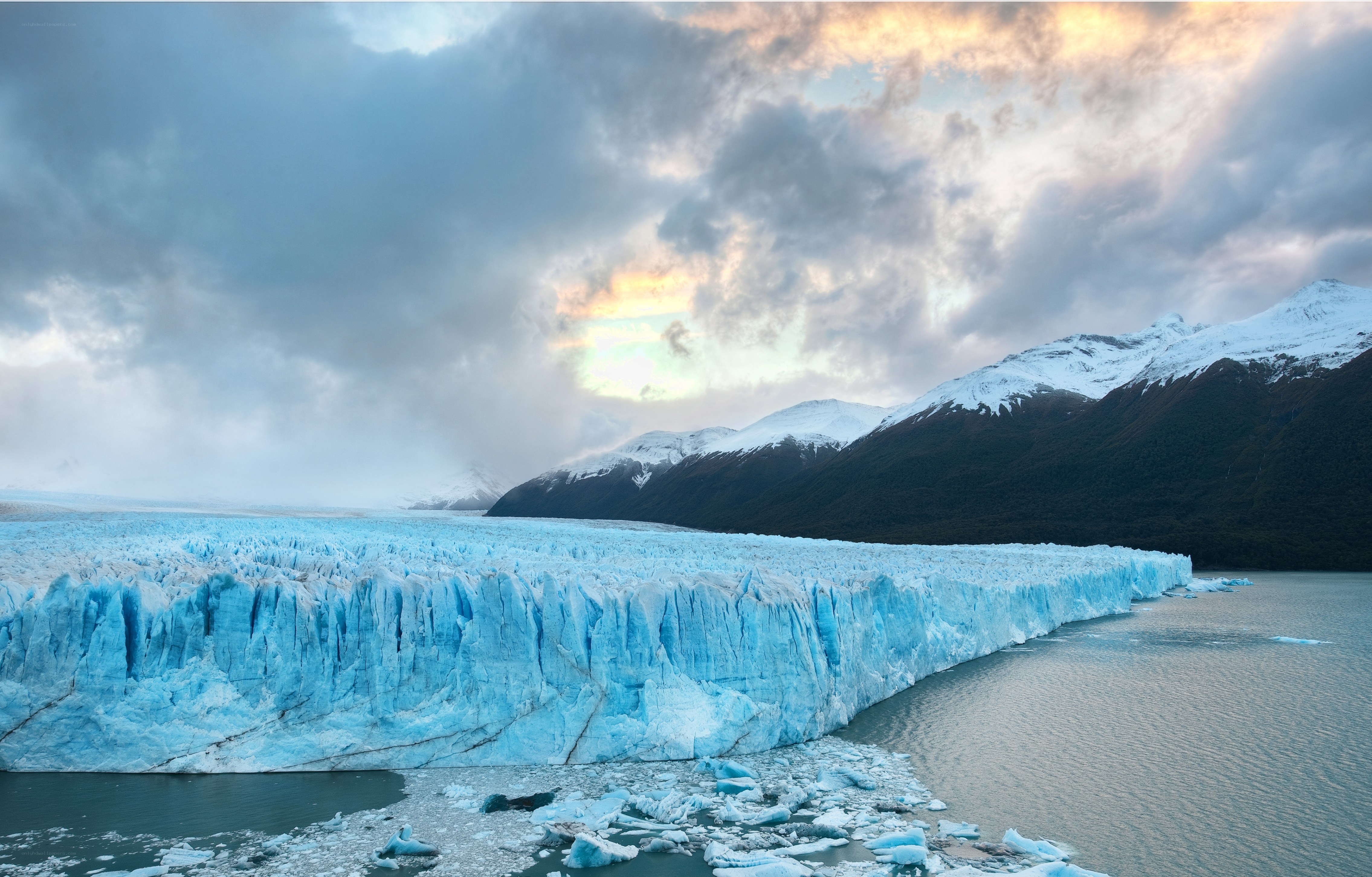 Glacier at sunset with mountains