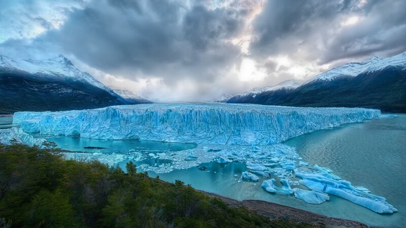 Glacier Calving into Lake — Blue, Dramatic, Sunset, Photograph, Mountains