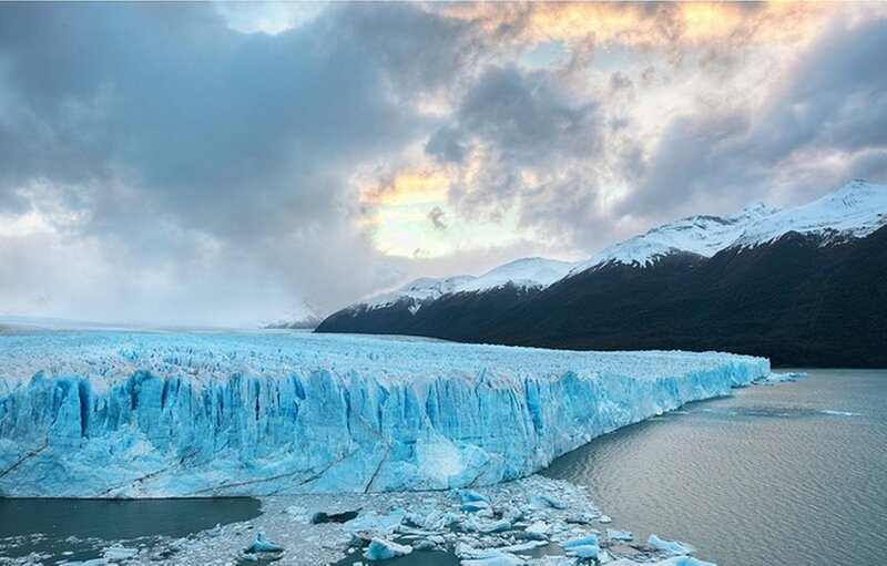 Glacier Calving into Lake — Blue, Dramatic, Sunset