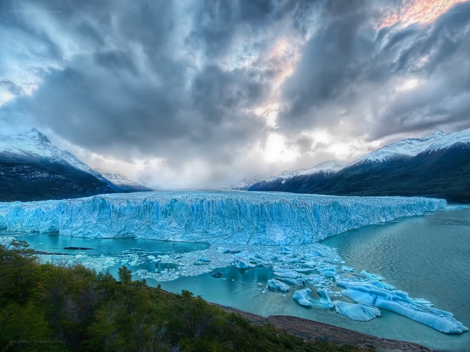 Glacier calving into lake