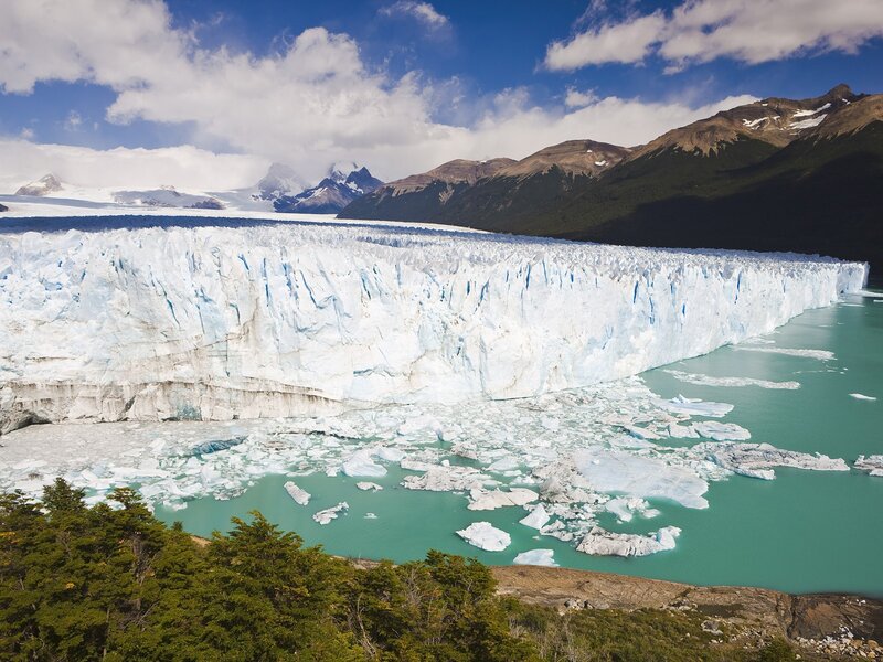 Glacier calving into turquoise lake