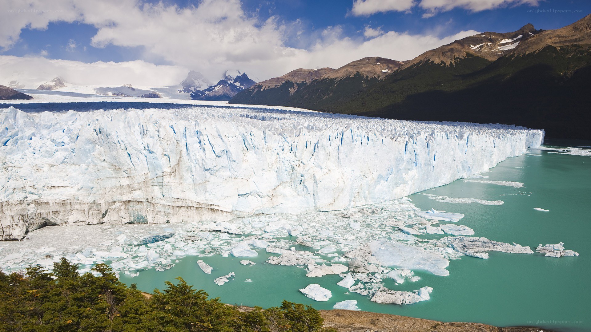 Glacier calving into turquoise lake