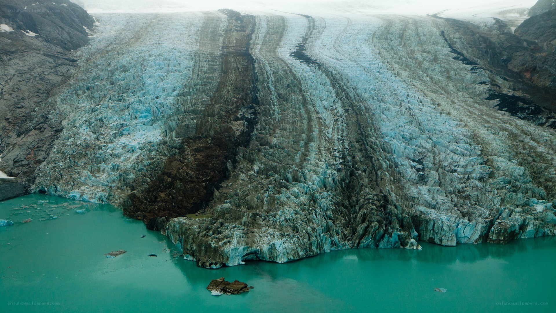 Glacier calving into turquoise water
