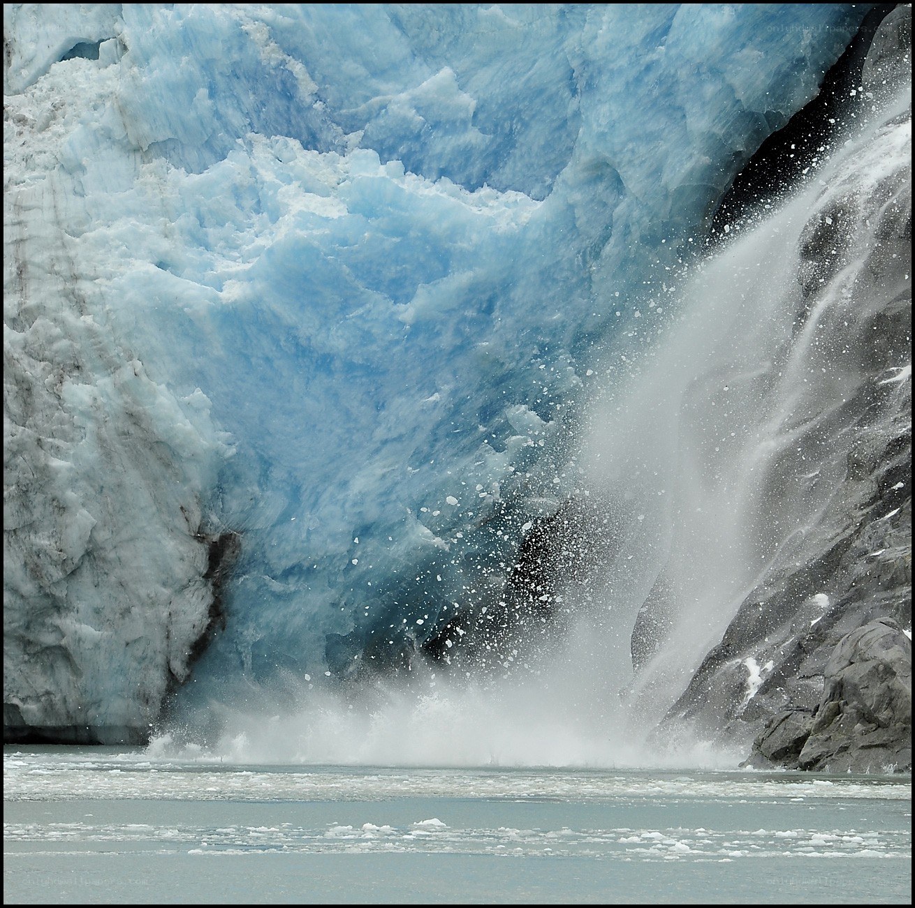 Glacier calving into water