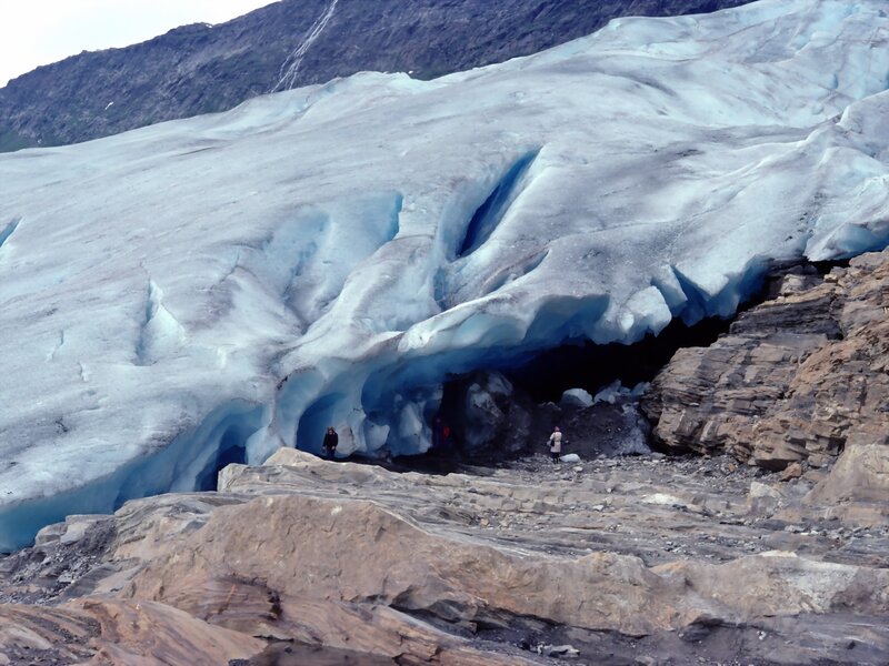 Glacier cave with visitors