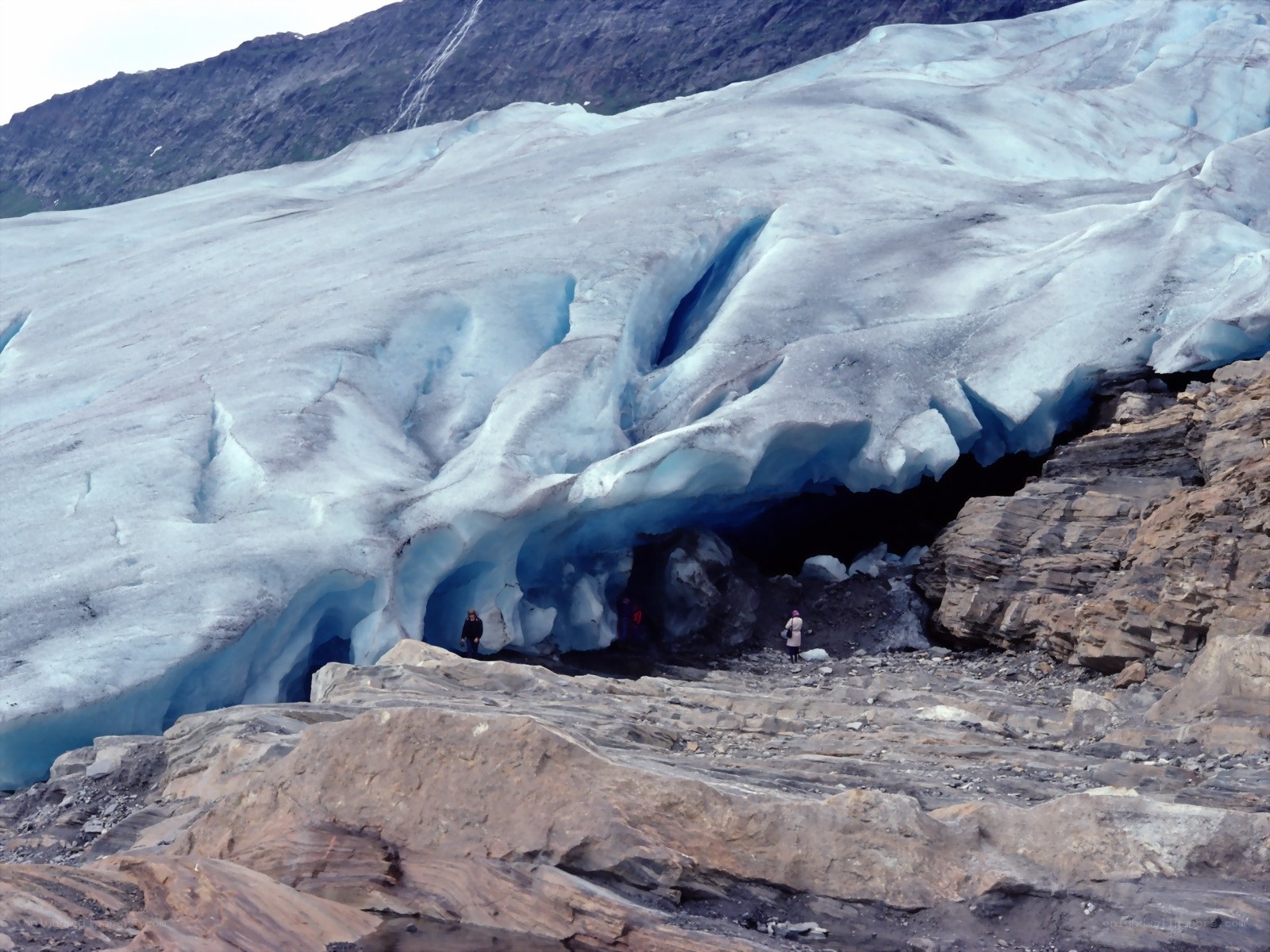 Glacier cave with visitors