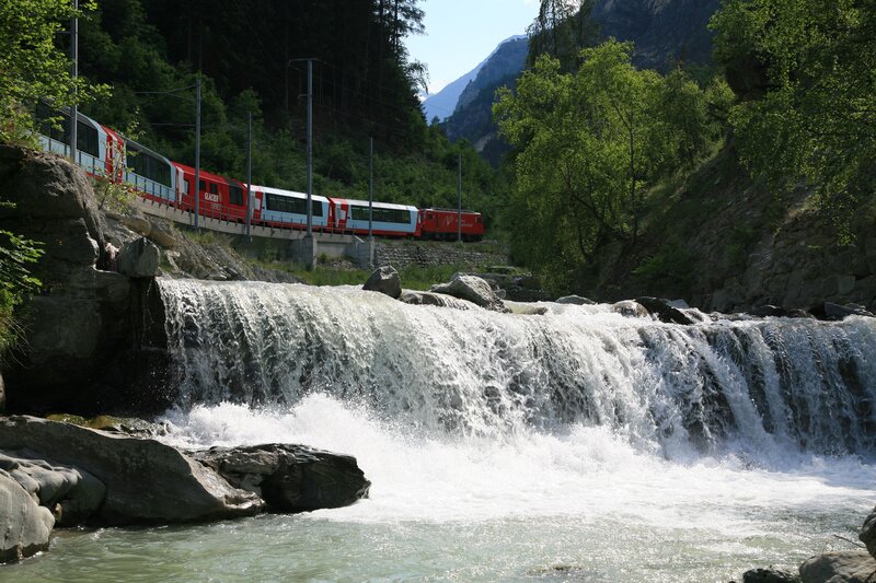 Glacier Express train crossing a river