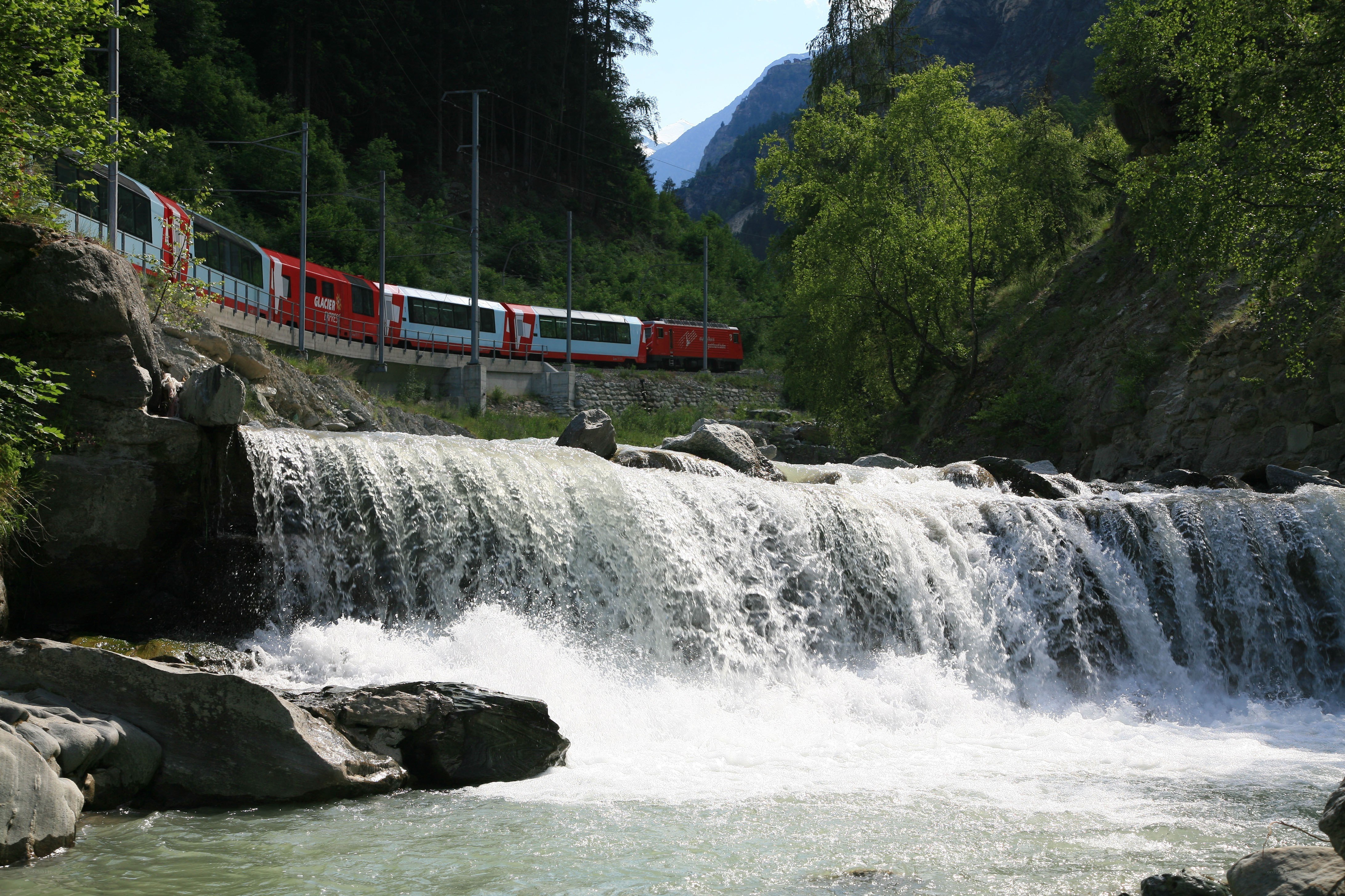 Glacier Express train crossing a river