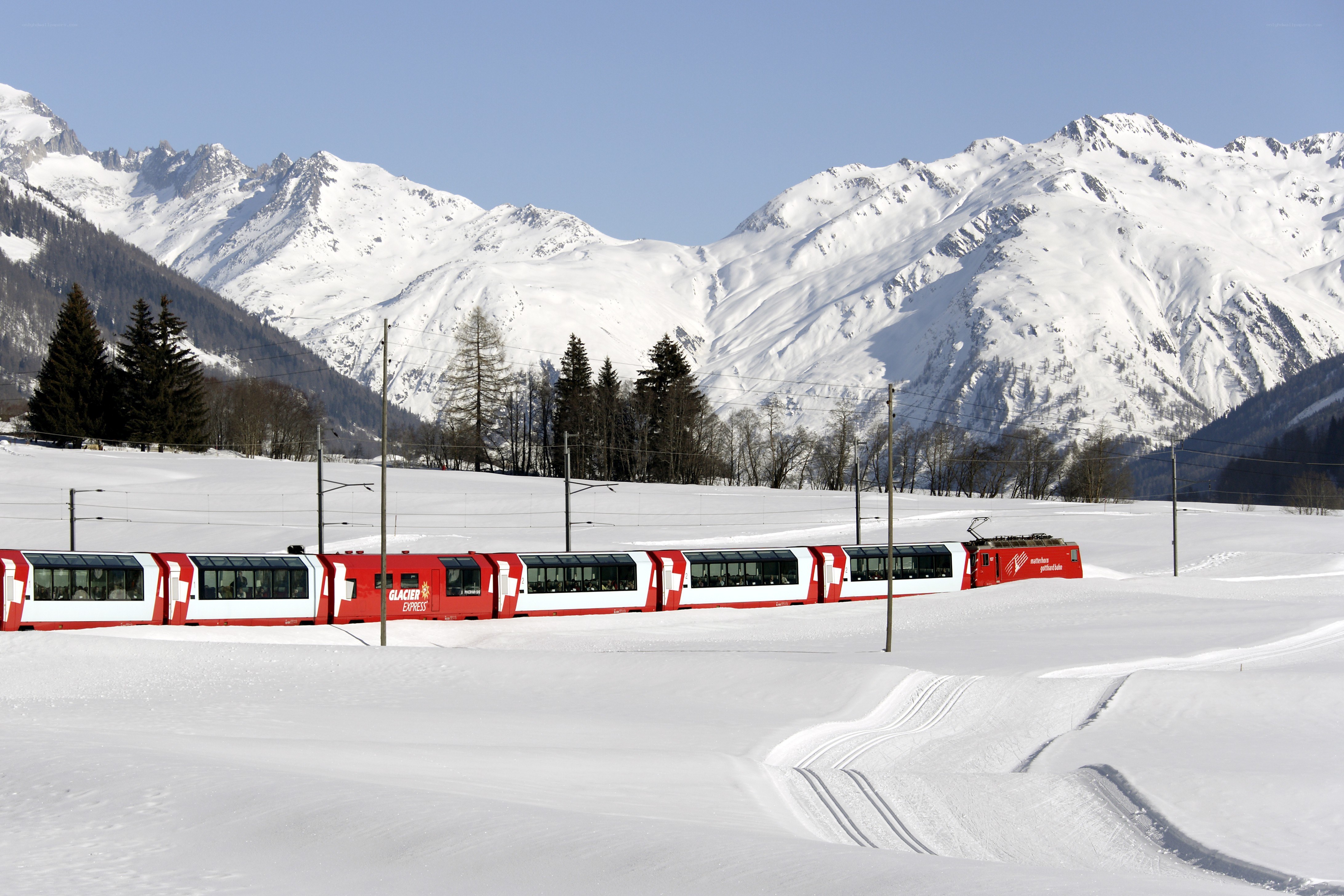 Glacier Express train in snowy mountains