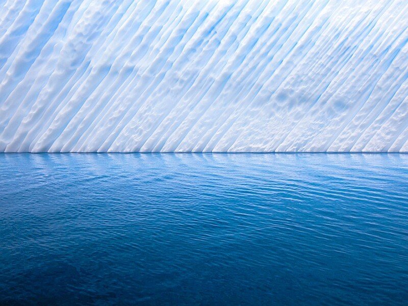 Glacier face with blue water