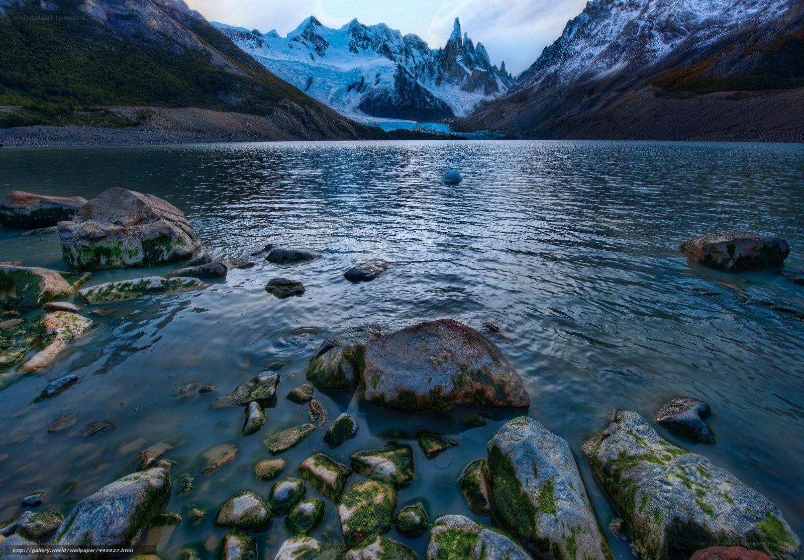 Glacier lake with mountain peaks