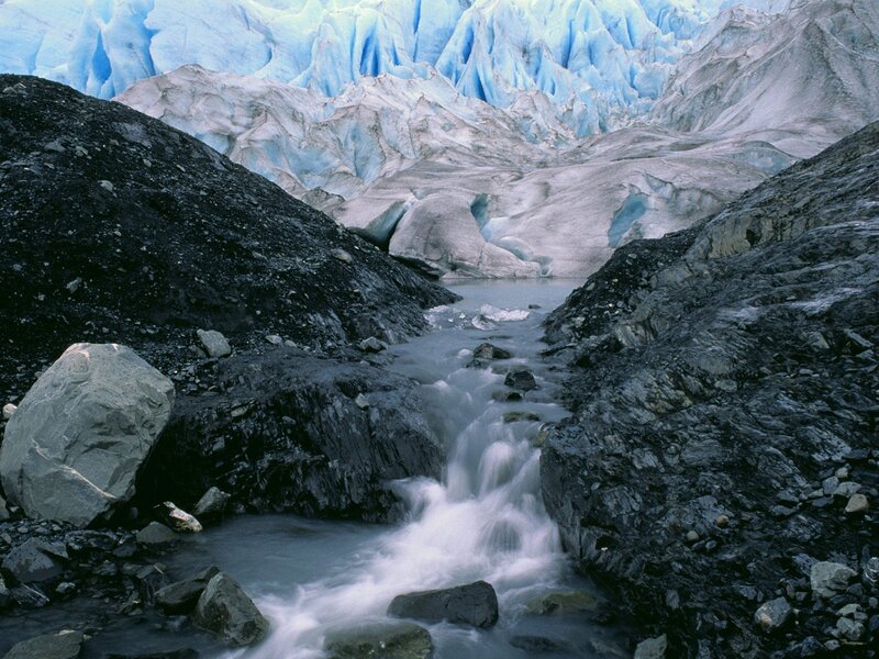 Glacier stream in rocky valley