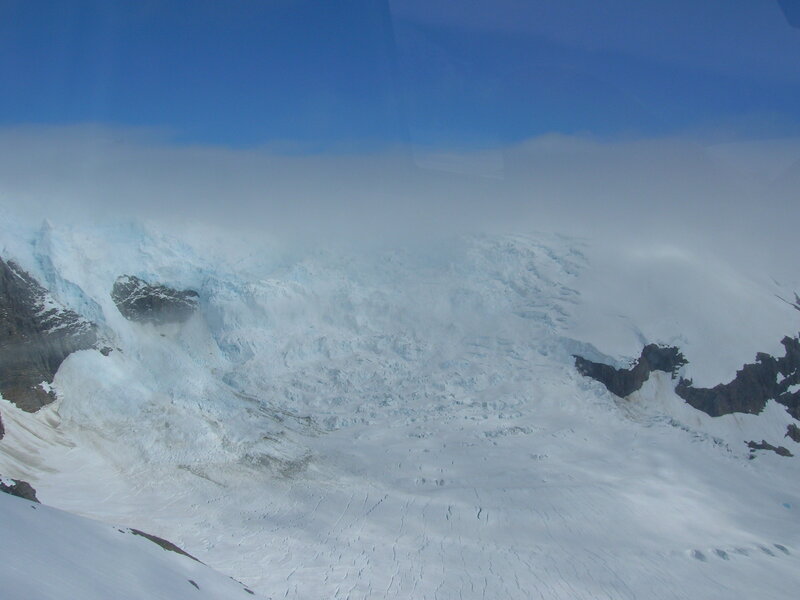 Glacier under cloudy sky