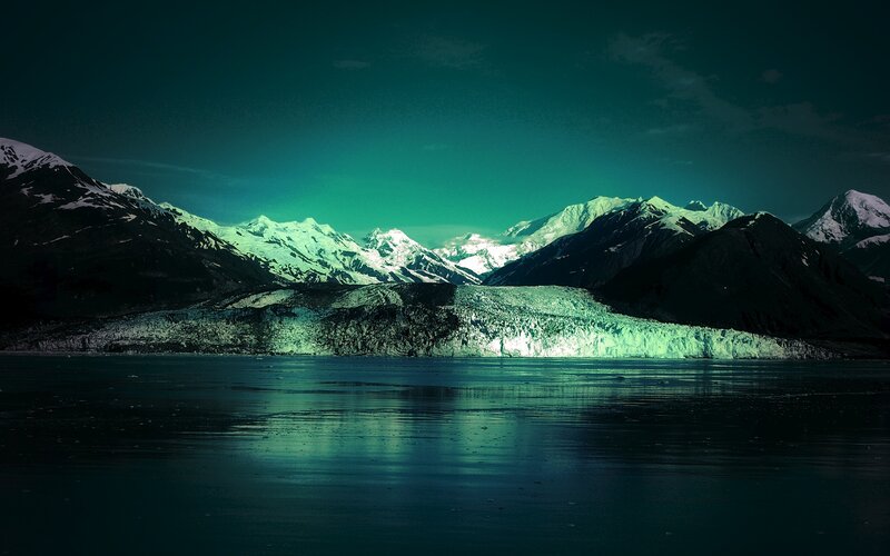 glacier under green aurora