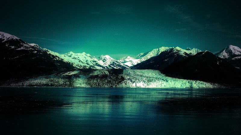 glacier under green sky