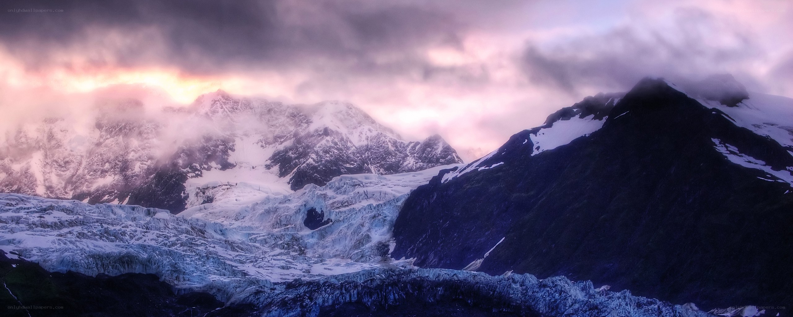 glacier under stormy sky