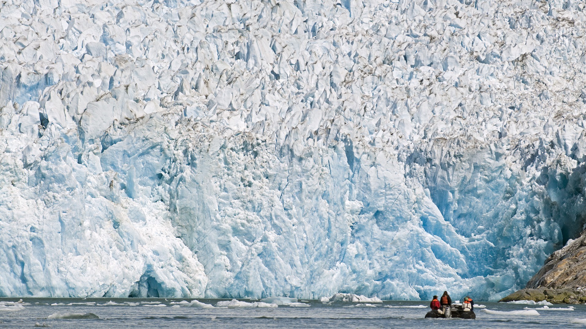 Glacier with boat in foreground