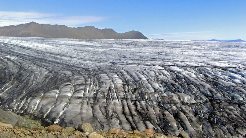 Glacier with mountain backdrop