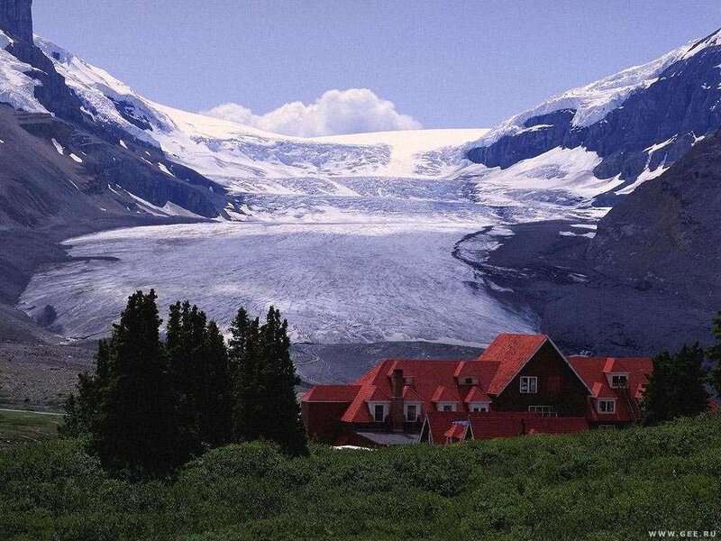 Glacier with red-roofed buildings