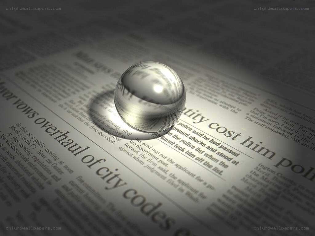 glass ball on newspaper