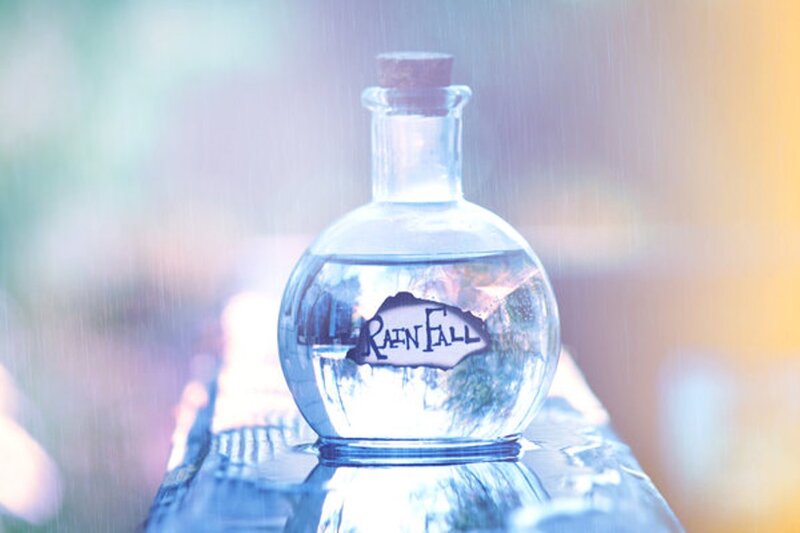 Glass Bottle Labeled RAINFO