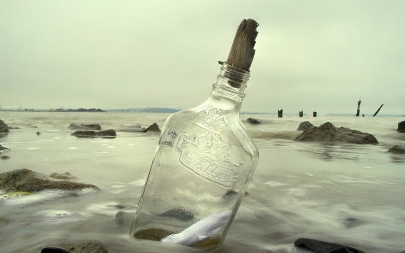 Glass Bottle on Beach — Gray