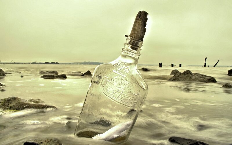 Glass Bottle on Beach — Green