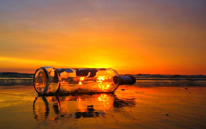 Glass Bottle on Beach — Orange