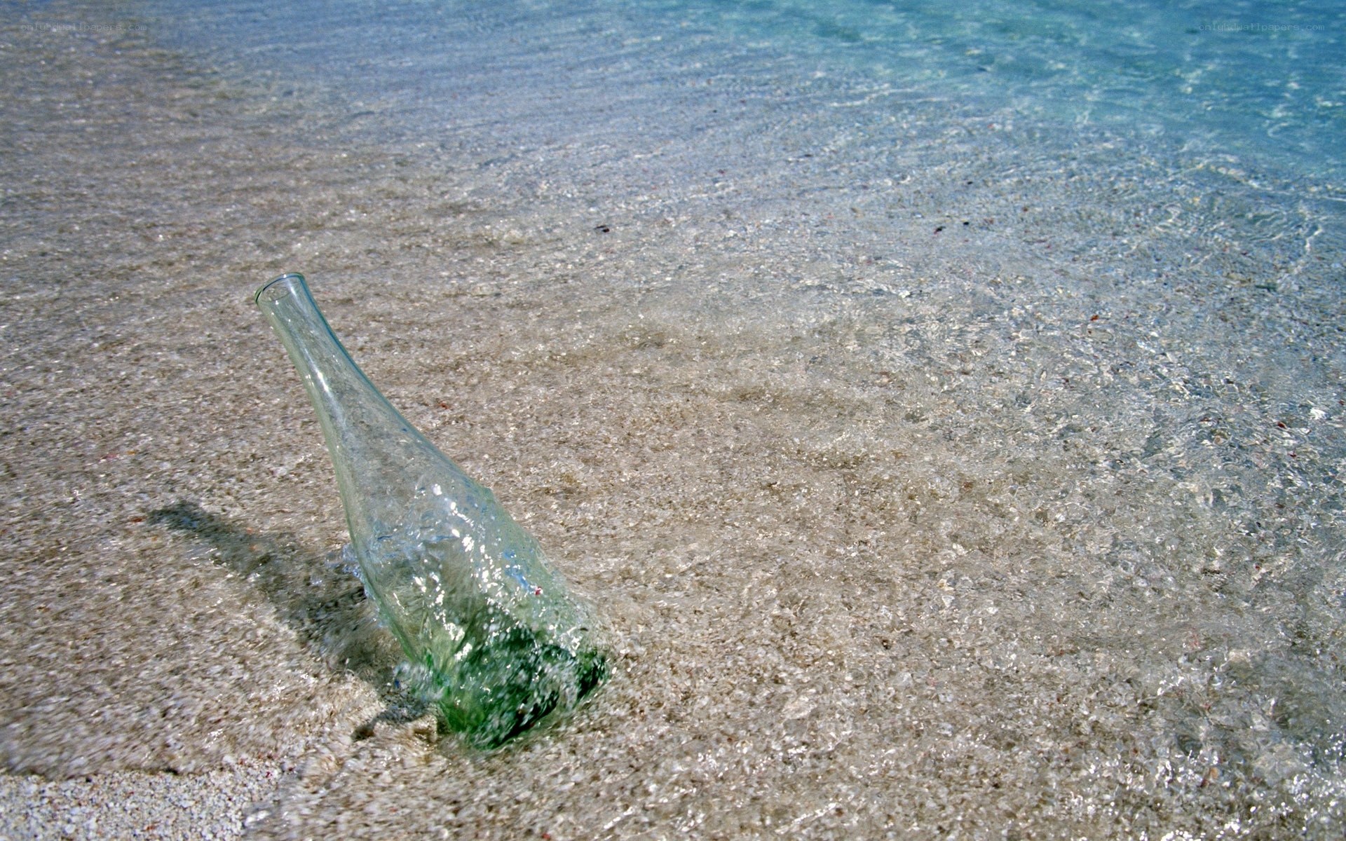 glass bottle on beach