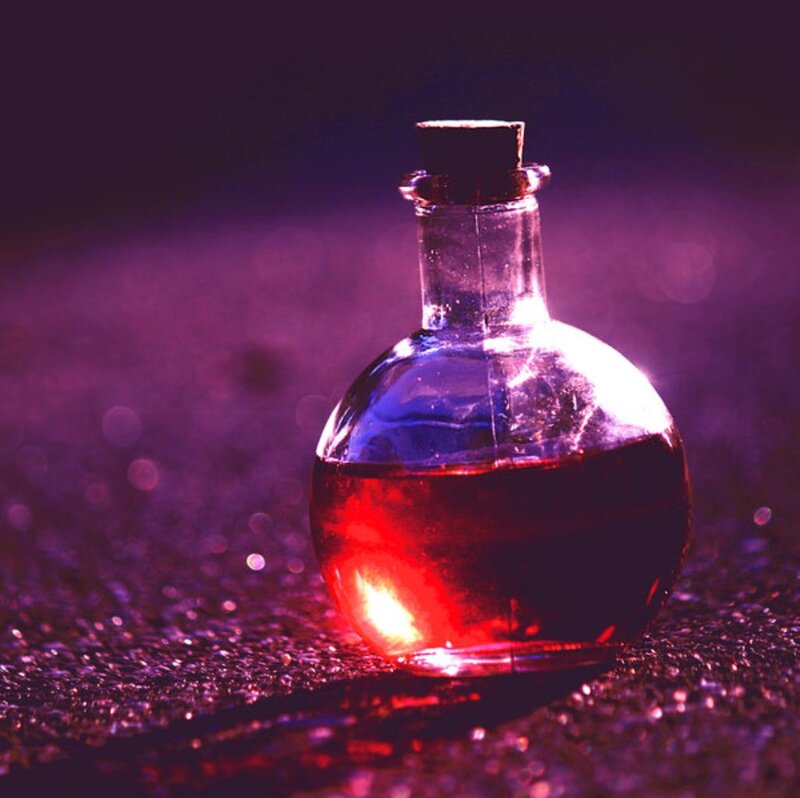Glass Bottle with Red Liquid — Dramatic