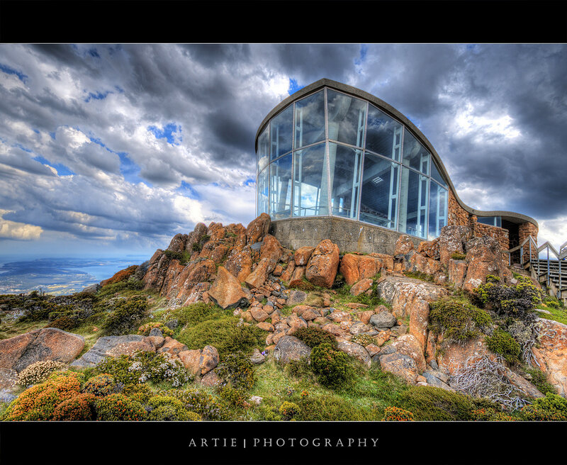 Glass building on rocky mountain
