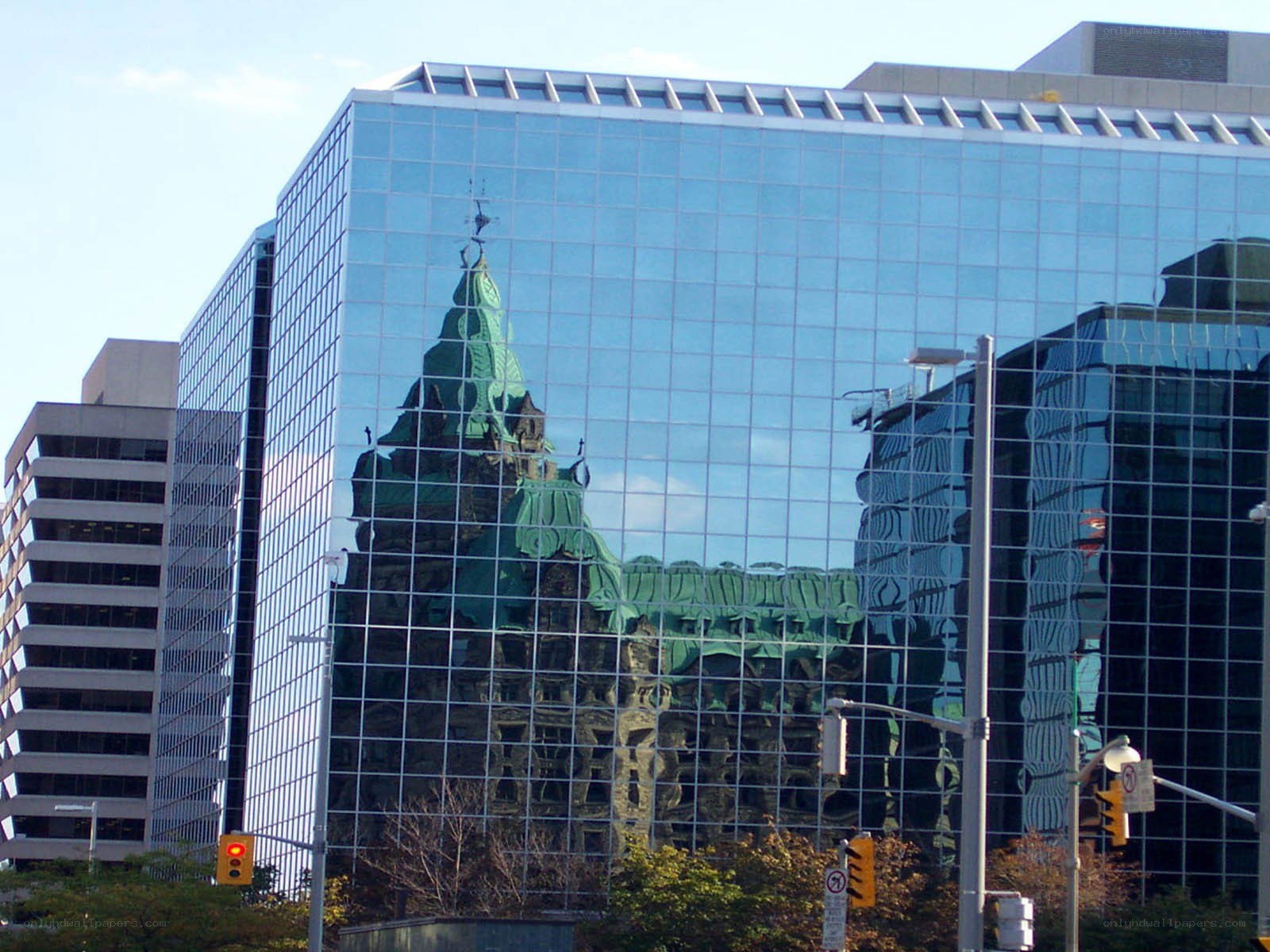 glass building reflecting historic architecture