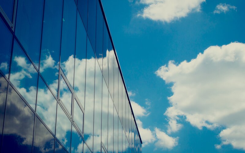 Glass Building Reflecting Sky