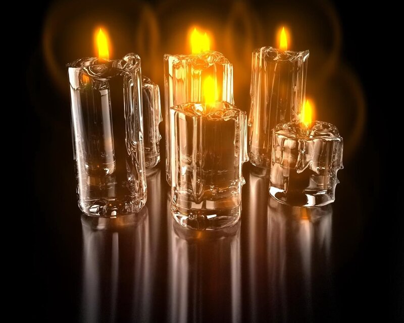 Glass Candles on Dark Surface