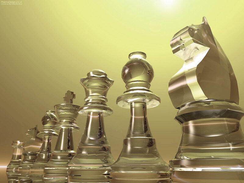 glass chess pieces in golden light