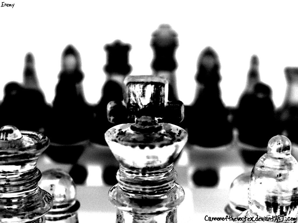 Glass chess pieces on board