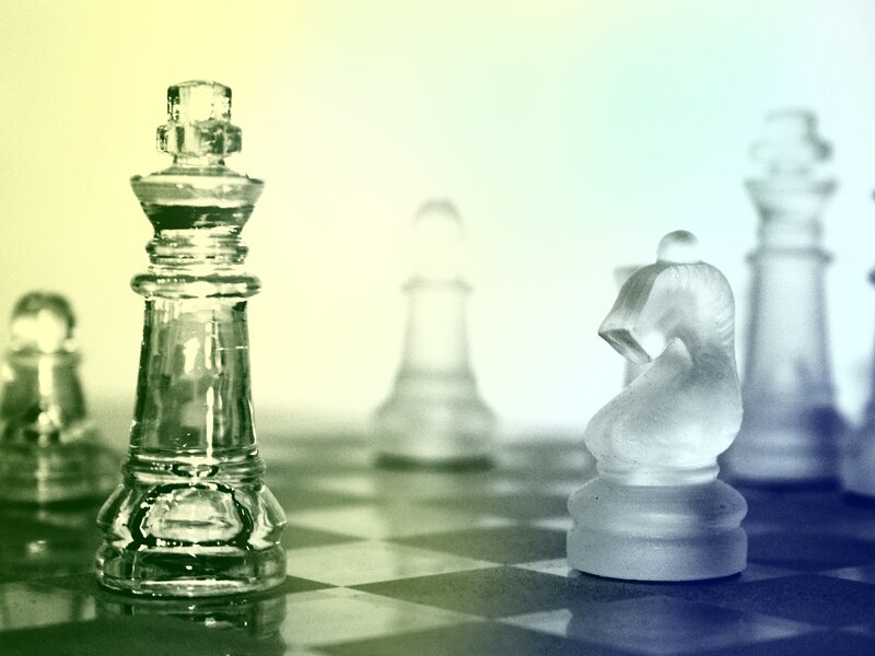 Glass chess pieces on board