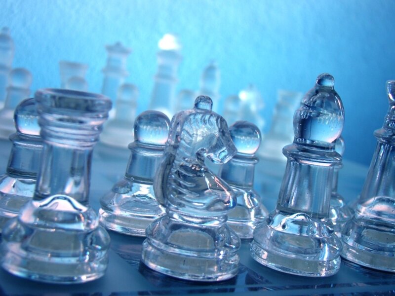 glass chess pieces on board