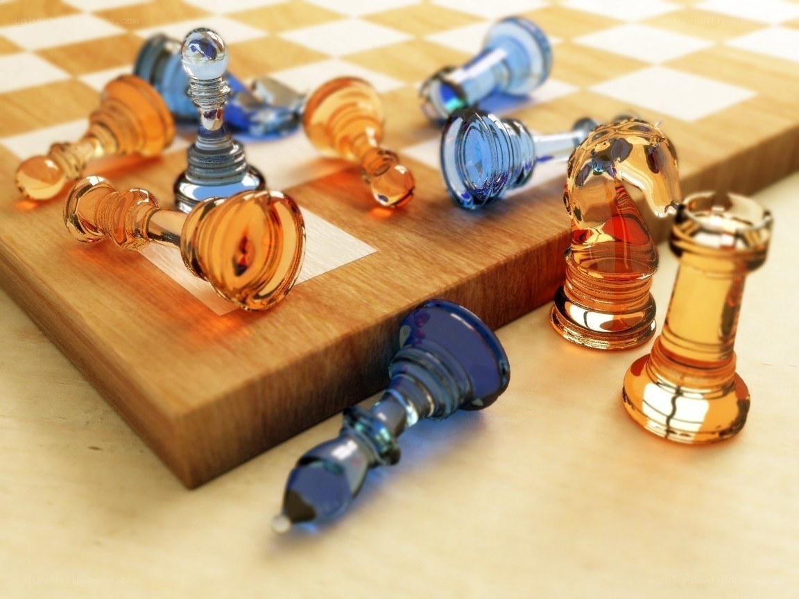 Glass chess pieces on board