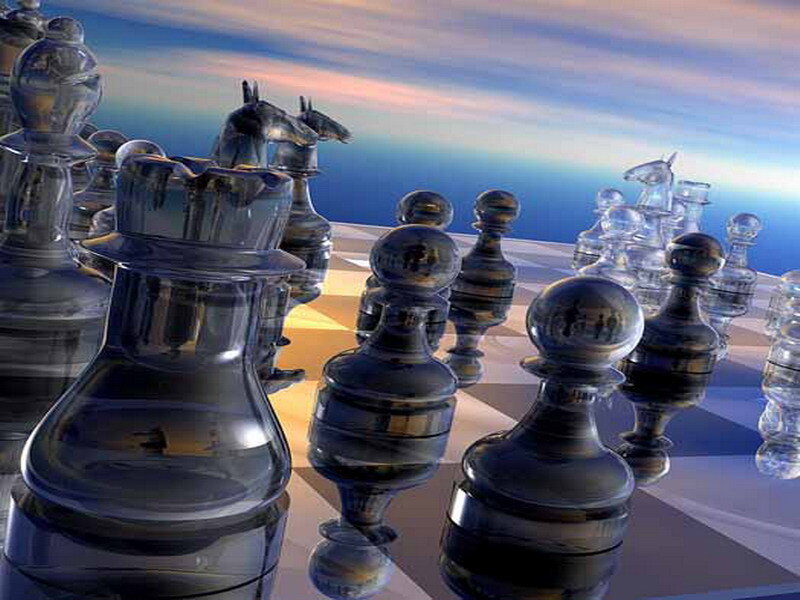 Glass chess pieces on board